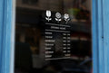 G19 - Bespoke flowers silhouette opening hours, vinyl cut window sticker, contour cut, for commercial windows/glass or walls.