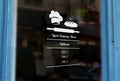 BK7 - Bespoke company name & opening hours, vinyl cut window sticker, contour cut, for commercial windows/glass or walls.